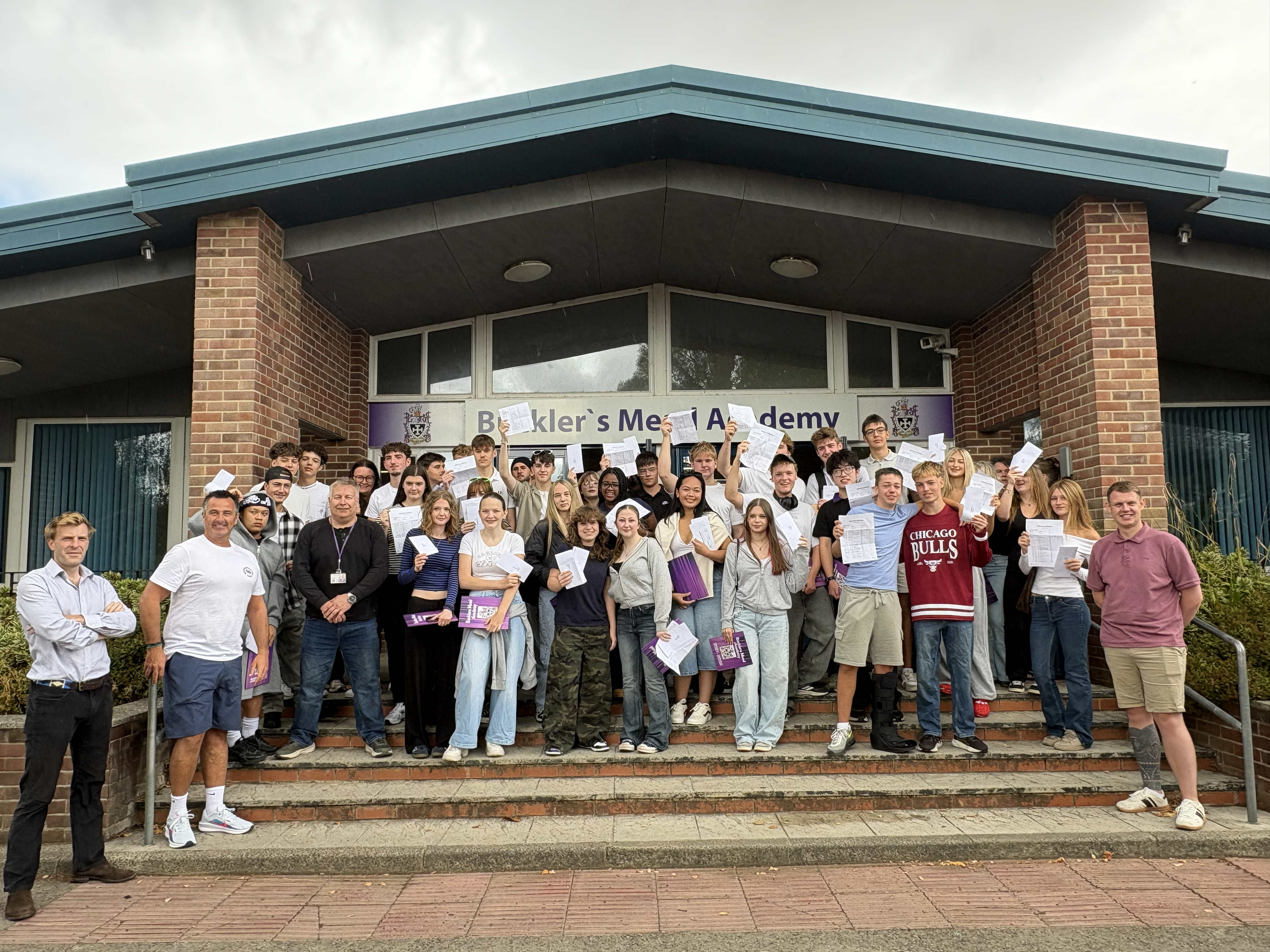 Image of students celebrating their GCSE results